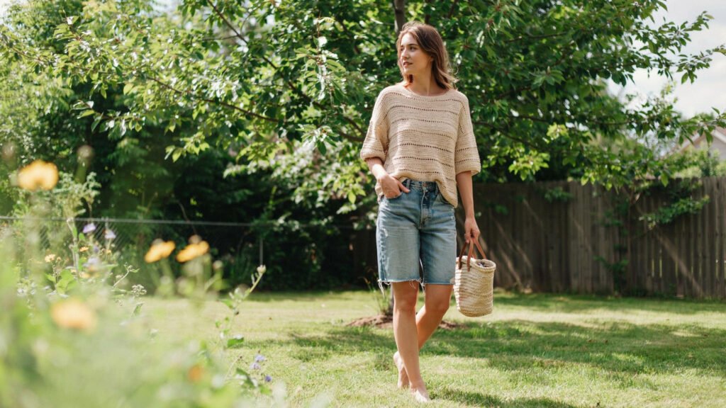 Camel cotton crochet crop top featuring textured waffle stitch grid pattern folded on a wooden surface