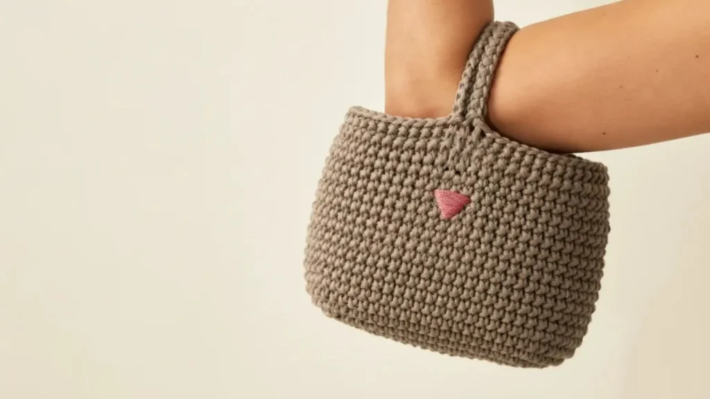 Minimalist crochet cat bag pattern for a clutch with a simple triangular nose detail