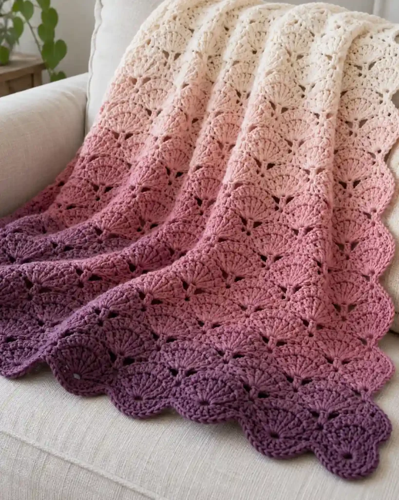 Finished ombre shell stitch blanket with realistic crochet stitch details and smooth color gradation.